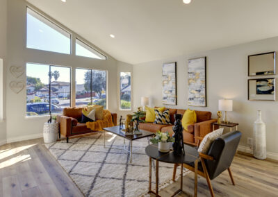 A photo of a light and spacious living room with nice furniture