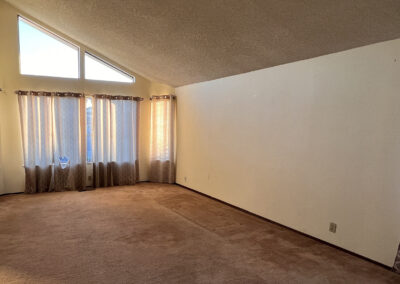 A photo of an old and empty living room