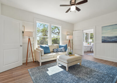 Living room in victorian style home with light tan couches