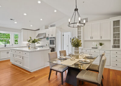 Kitchen and dining room with white cabinets